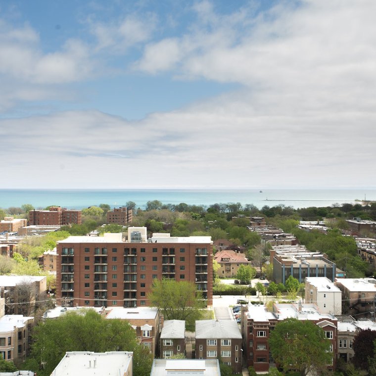 Ariel view of area with tall buildings and view of Lake Michigan